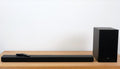 Samsung Soundbar A650 with wireless subwoofer on shelf