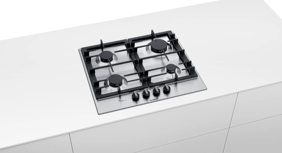 Bosch Gas Hob 4 Burner stainless steel built into white kitchen countertop