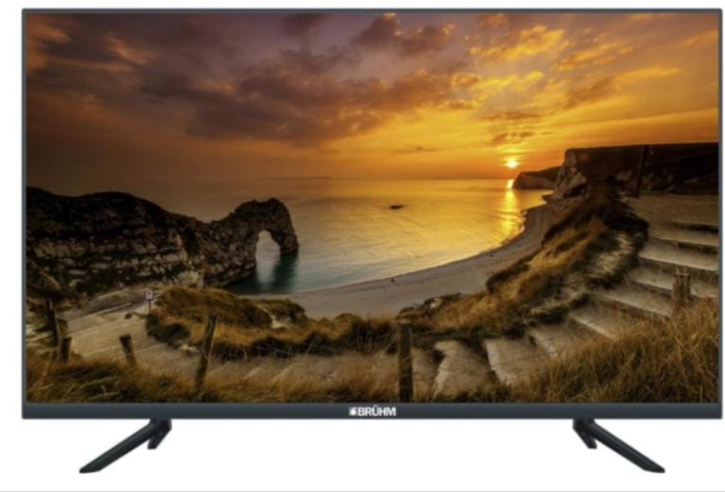 Bruhm 43 inch Smart LED TV Full HD displaying stunning golden sunset coastal landscape